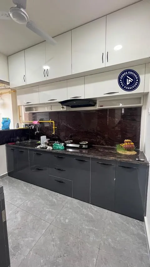 Charcoal PVC modular kitchen with white loft units and a granite backsplash - Shree Krushn PVC Furniture, Nikol, Ahmedabad
