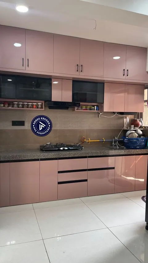 Rose pink high gloss PVC modular kitchen with black glass shutters and a spice shelf - Shree Krushn PVC Furniture, Nikol, Ahmedabad