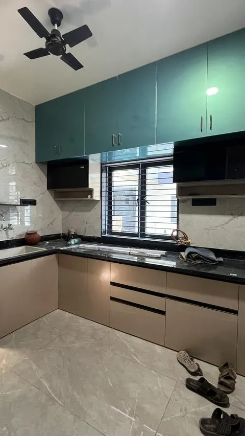 Teal and beige PVC modular kitchen in L shape with a marble backsplash - Shree Krushn PVC Furniture, Nikol, Ahmedabad