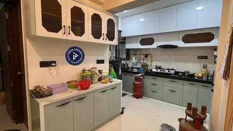 Mint green PVC modular kitchen with reeded glass units and a side counter run - Shree Krushn PVC Furniture, Nikol, Ahmedabad