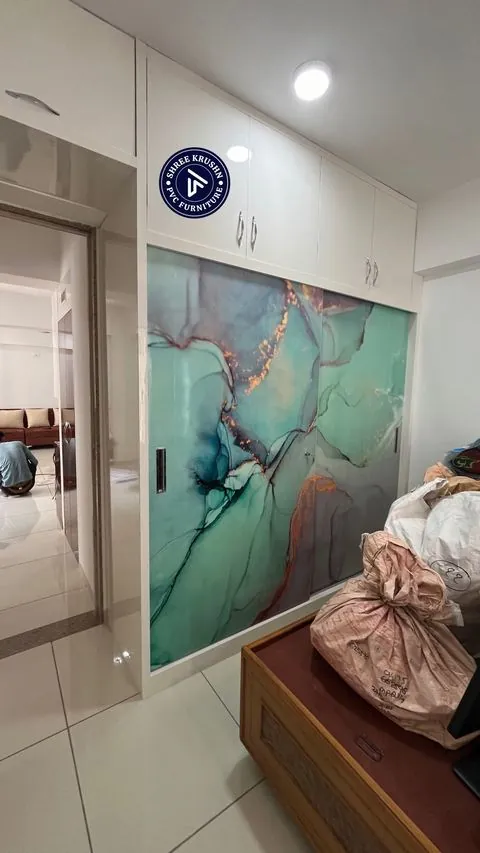 PVC sliding wardrobe with a turquoise and gold marble print on the shutters - Shree Krushn PVC Furniture, Nikol, Ahmedabad