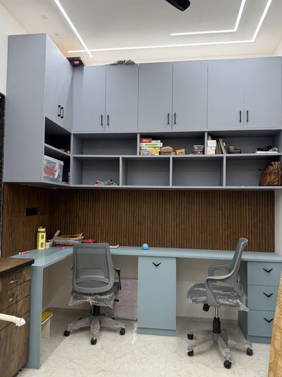 Grey PVC study table with wooden fluted panel by Shree Krushn, Ahmedabad